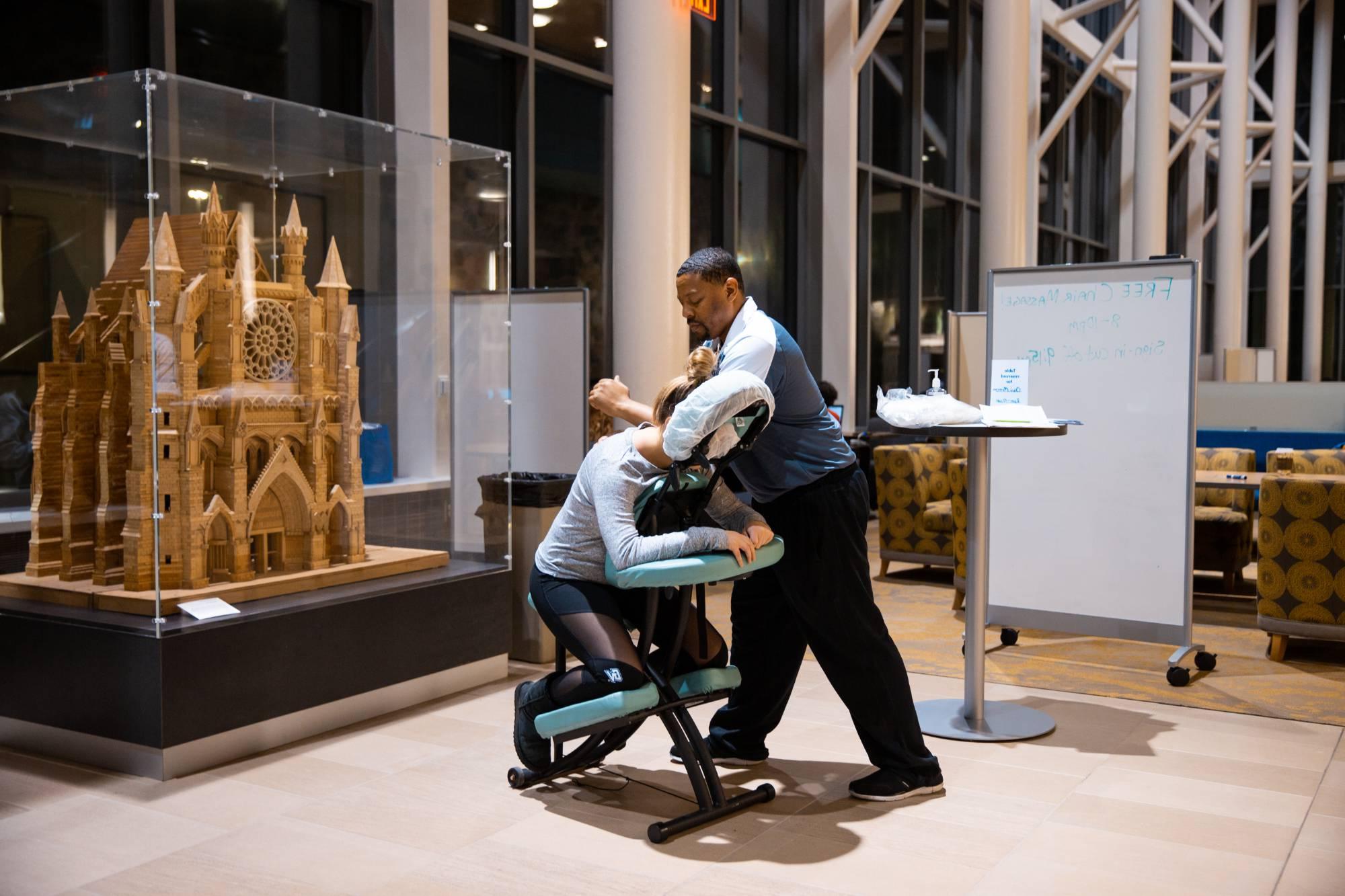 student receiving a massage in the GVSU library